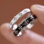 Black and White Iris Sterling Silver Couple Rings